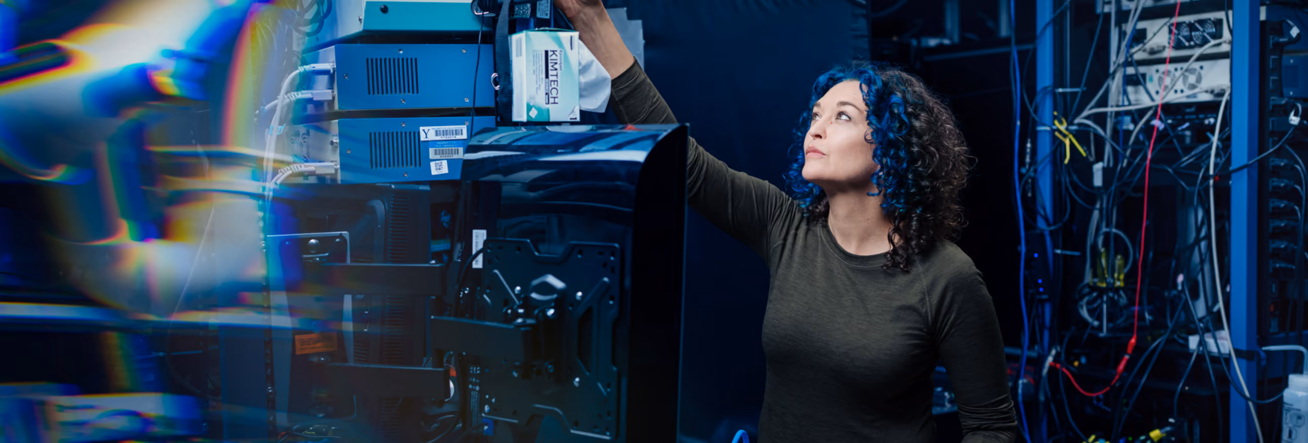 Jess adjusting a piece of lab equipment