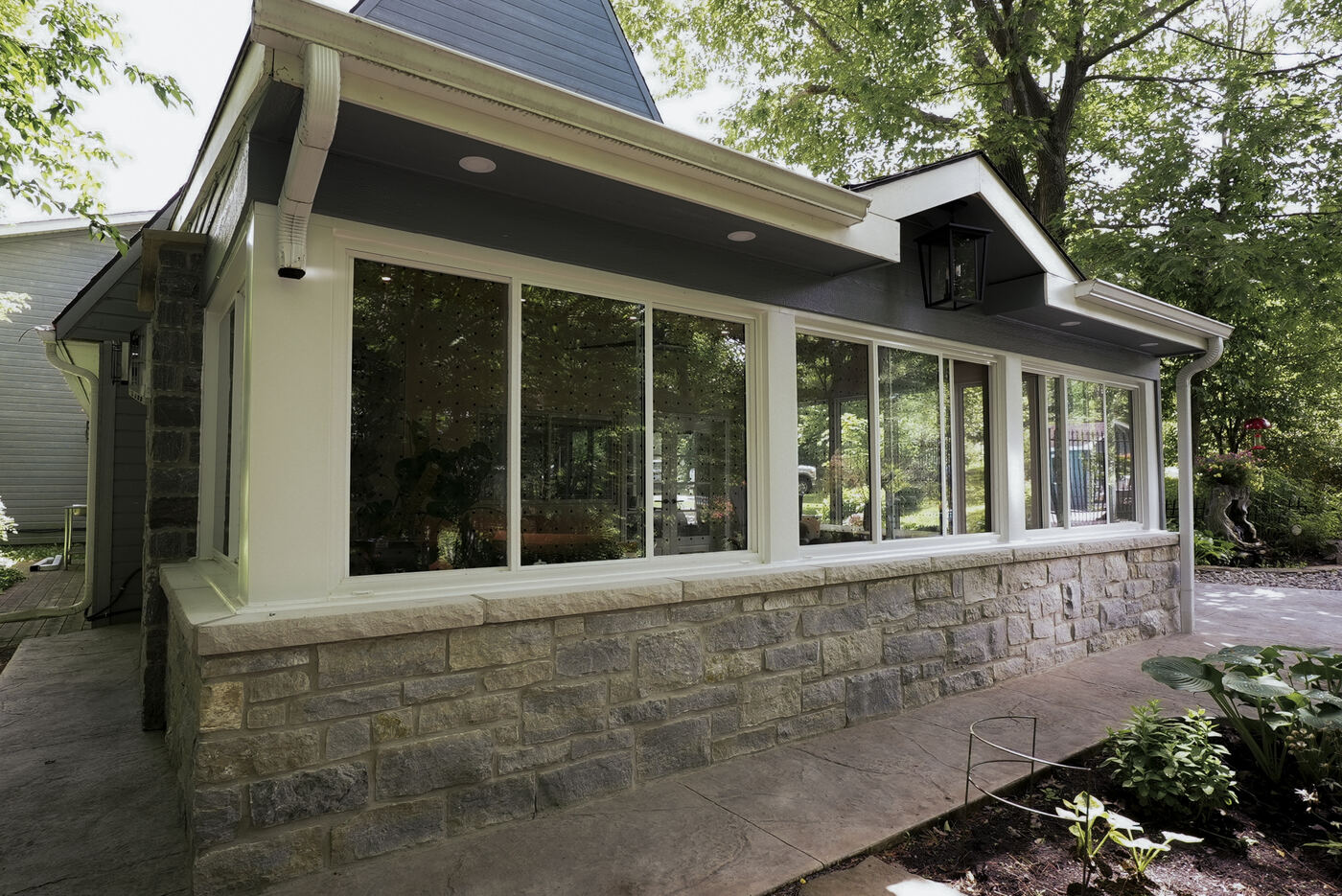 Custom limestone sunroom on a Kingston home