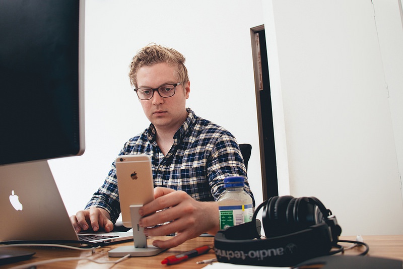 Devin Fountain checking his prototypes from his iPhone 6
