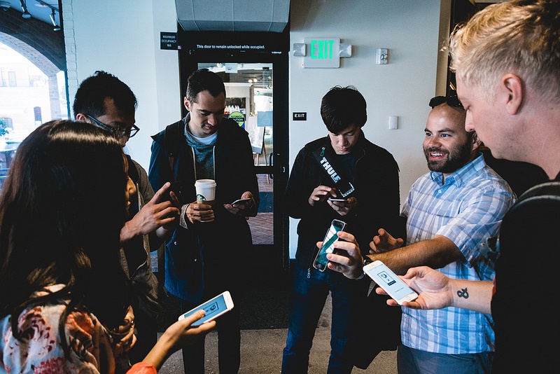 Yetis show off their phones to each other