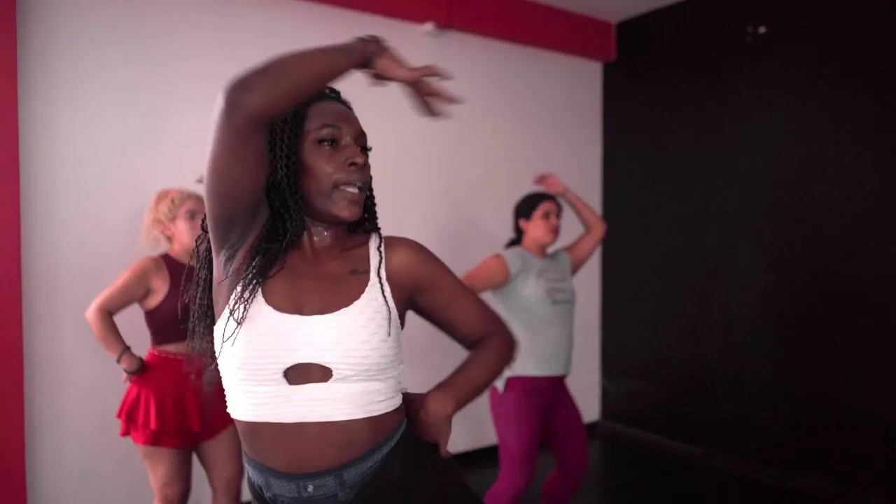 Three dancers moving together in a studio, from the Dance Your Ancestors invitation film