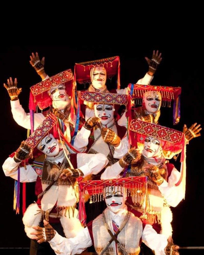Dancers in costume performing choreography by Cynthia Paniagua