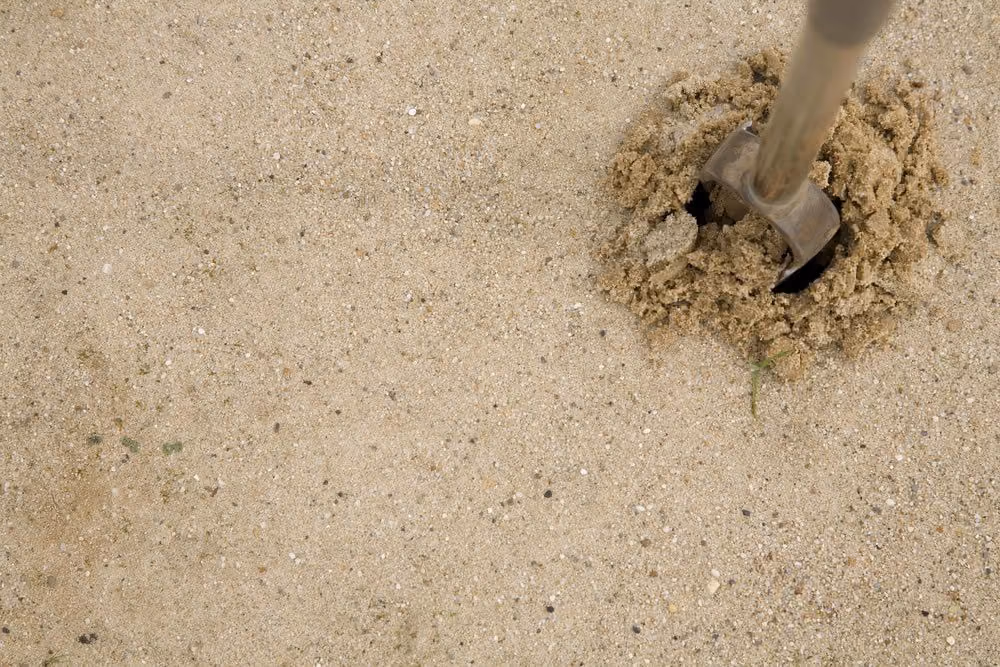 Soil probe in sandy ground during a site assessment