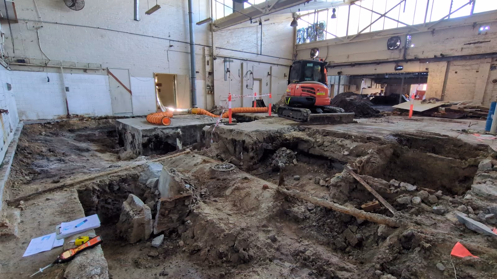 Excavation inside a warehouse during contaminated land remediation