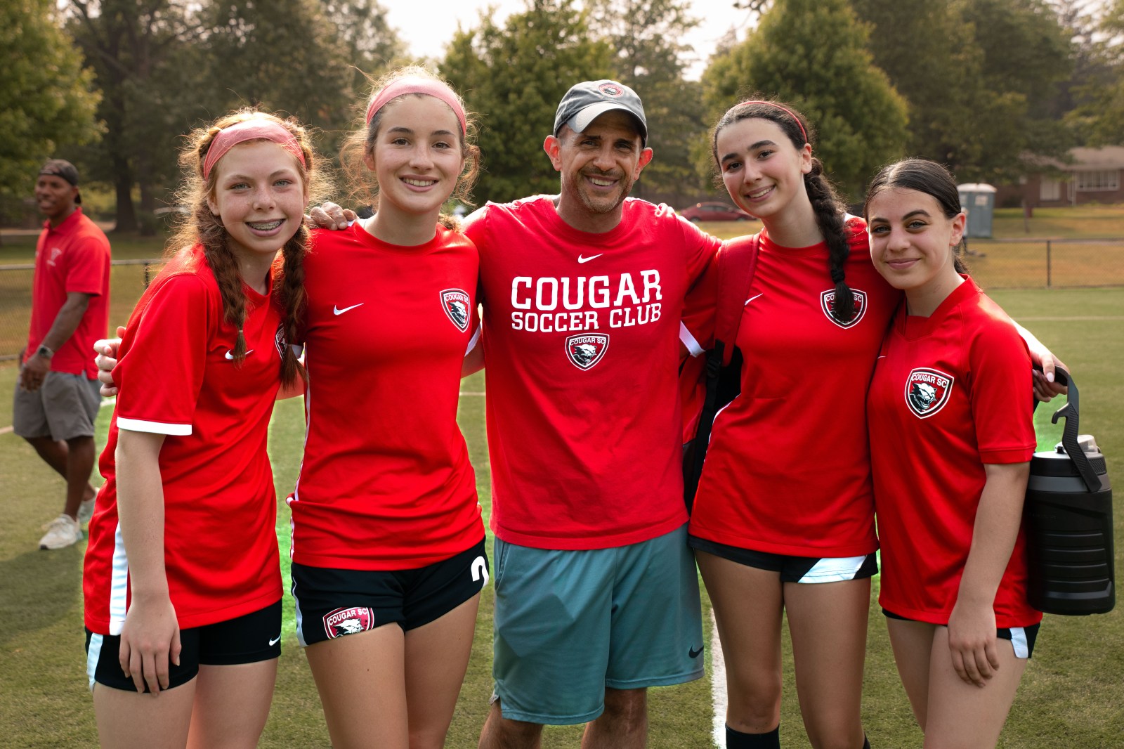 Cougar Soccer Club volunteers and team