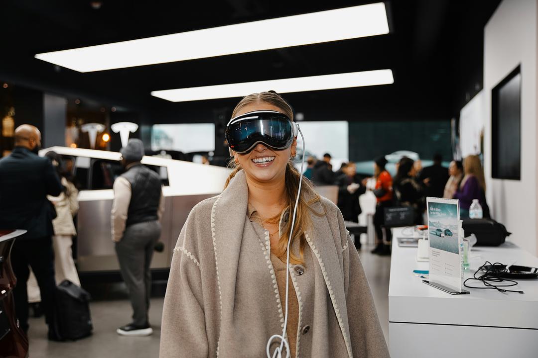 Woman trying on a pair of glasses, illustrating a virtual try-on retail experience for eyewear