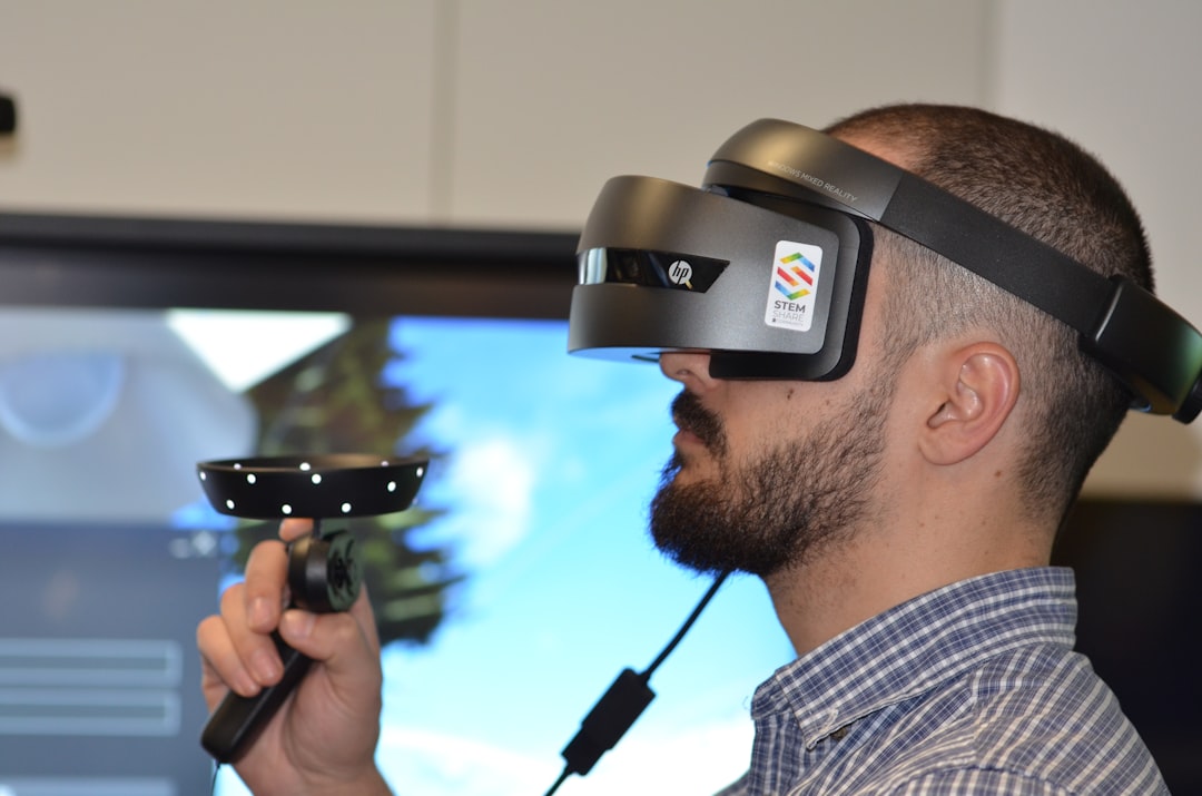 Close-up of a gray and black head-mounted VR display showing the lenses and padded facial interface