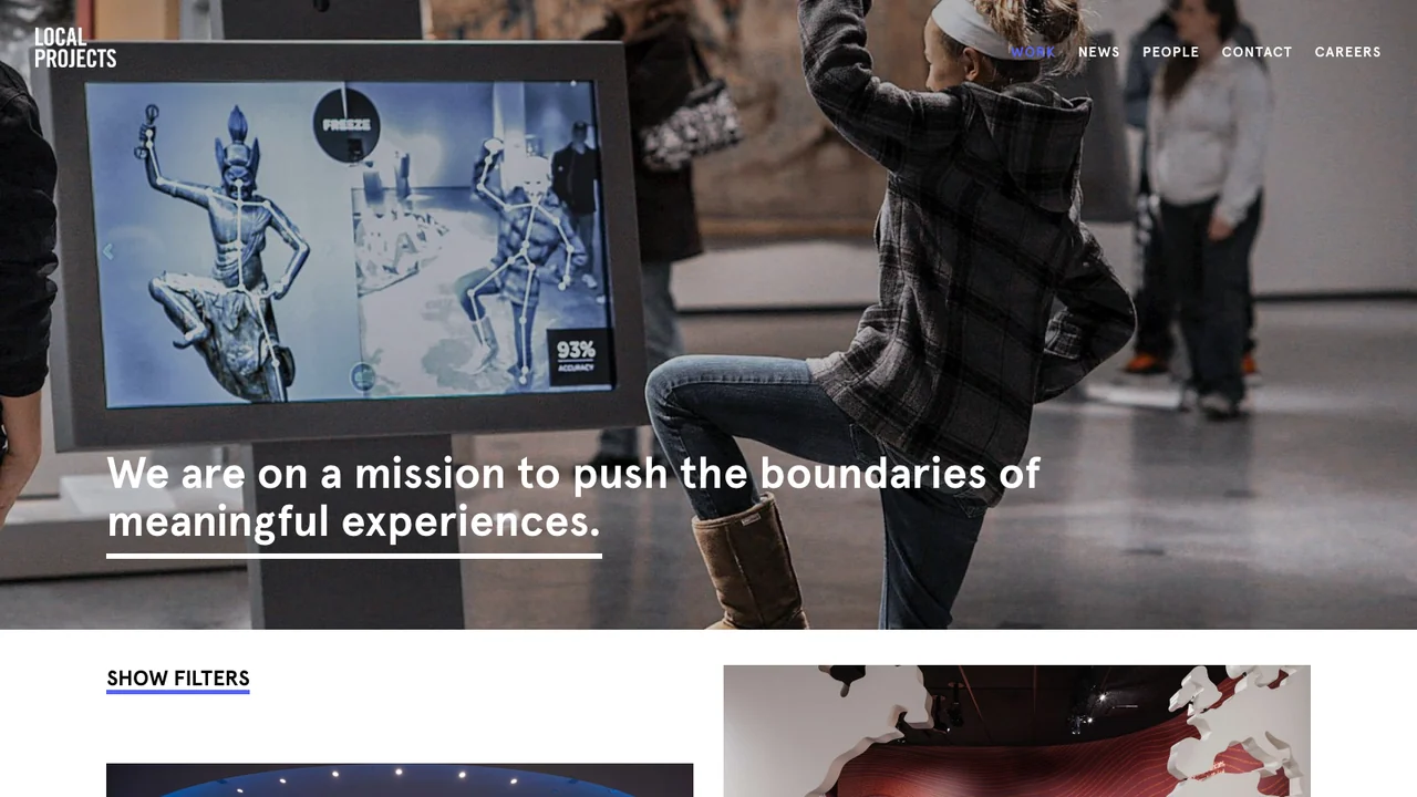 Local Projects work page, showing a child in a museum gallery interacting with a large touchscreen exhibit.