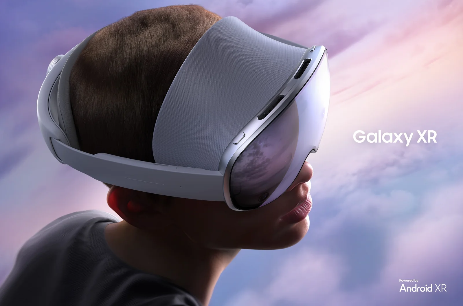 A person wearing the white Samsung Galaxy XR headset seen from the side against a pink and purple sky, captioned Galaxy XR and Powered by Android XR