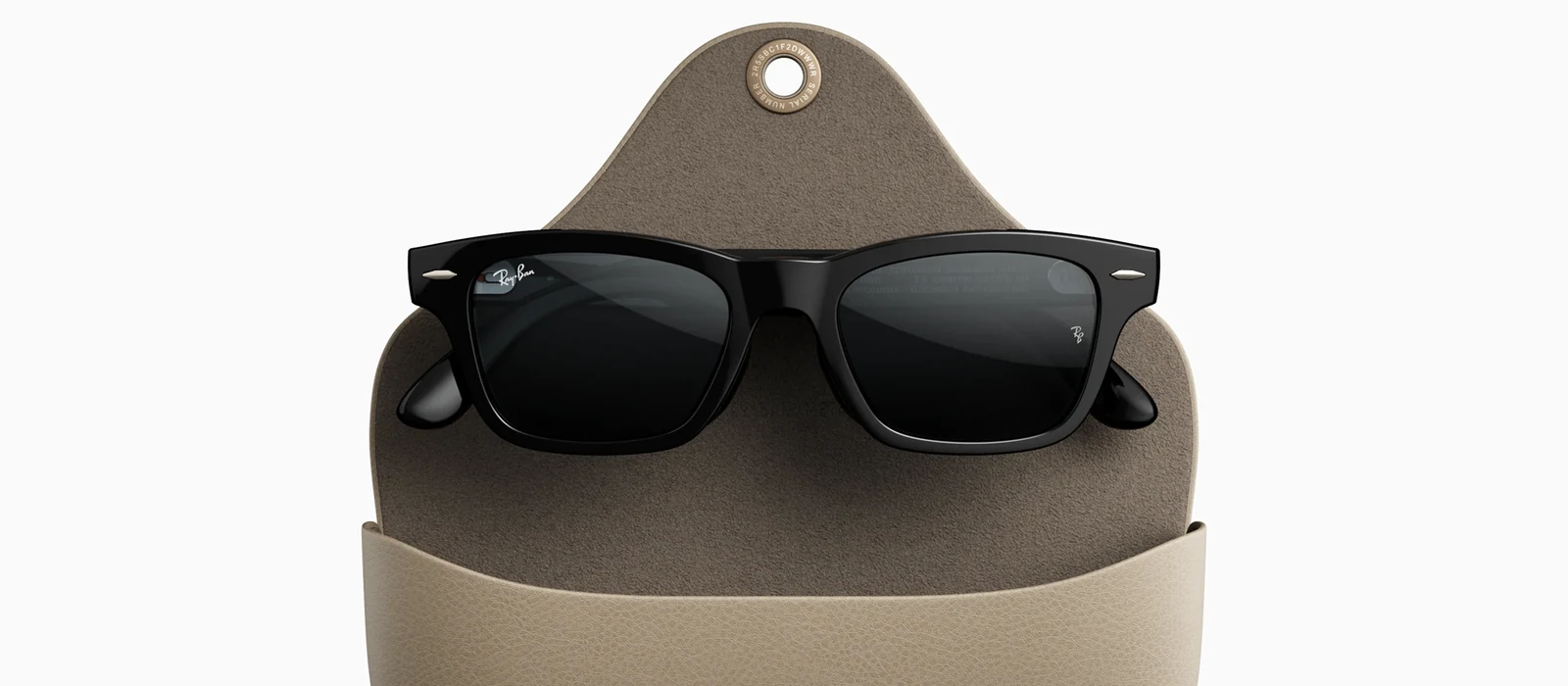 Ray-Ban Meta Audio Burbank glasses, a black rectangular frame with dark lenses, folded and resting in an open taupe fold-over case, with no camera lens in either front corner