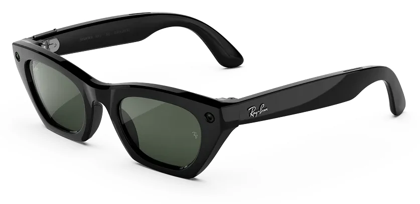 Ray-Ban Meta Gen 3 Zena glasses at three quarters on white, a shiny black cat-eye frame with green lenses, a camera in one outer corner and a capture LED in the other