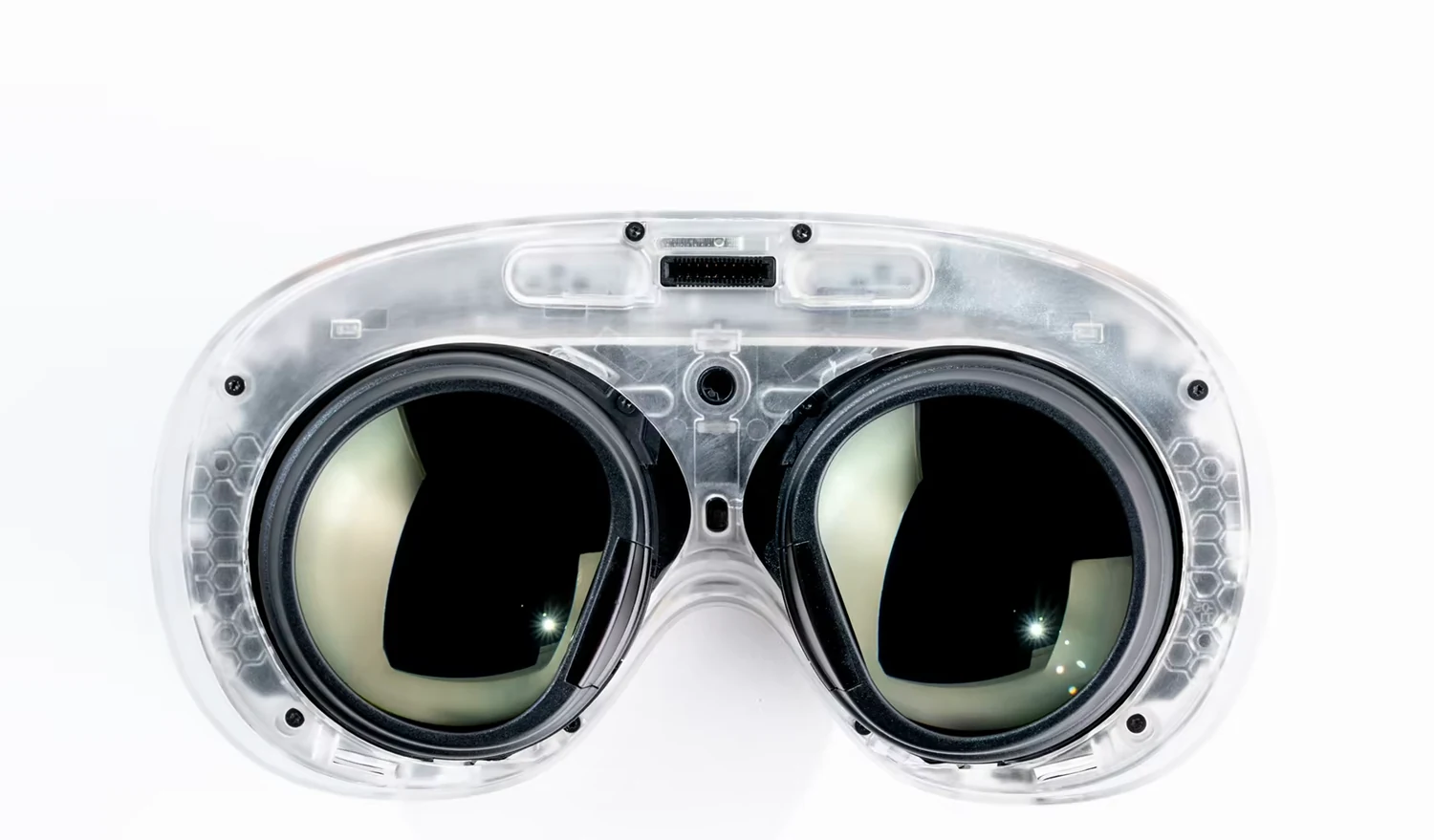 Valve Steam Frame headset shown head on in a transparent shell, so the two circular lenses, the internal boards and the fasteners are all visible through the casing