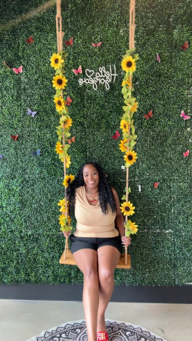 Tia Lynn Johnson on a sunflower swing
