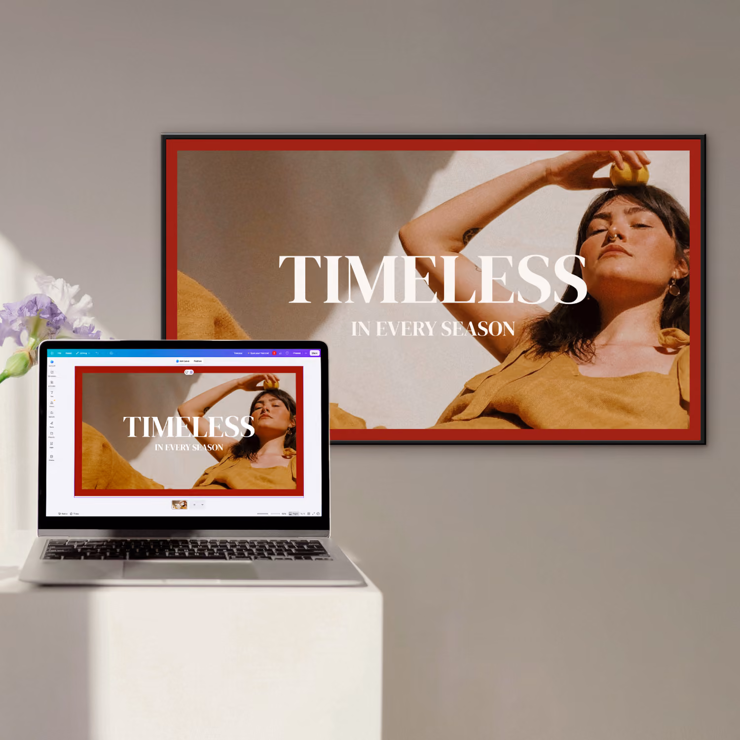 Laptop displaying an image of a woman in mustard clothing holding a lemon on her forehead with the text 'TIMELESS IN EVERY SEASON,' next to a larger wall screen showing the same image and text.