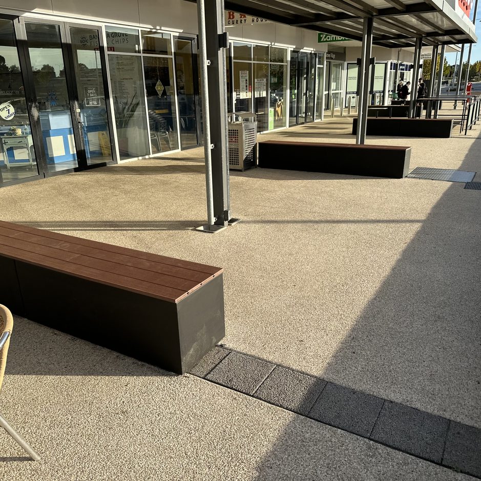 Shopping centre planters upgraded to composite decking benches