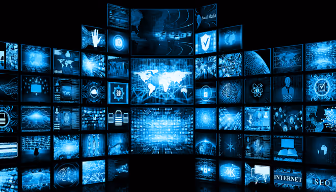 Curved wall of multiple blue digital 