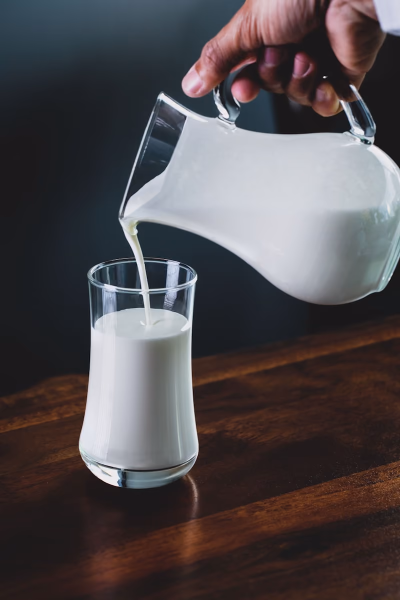 Milk being poured into a glass
