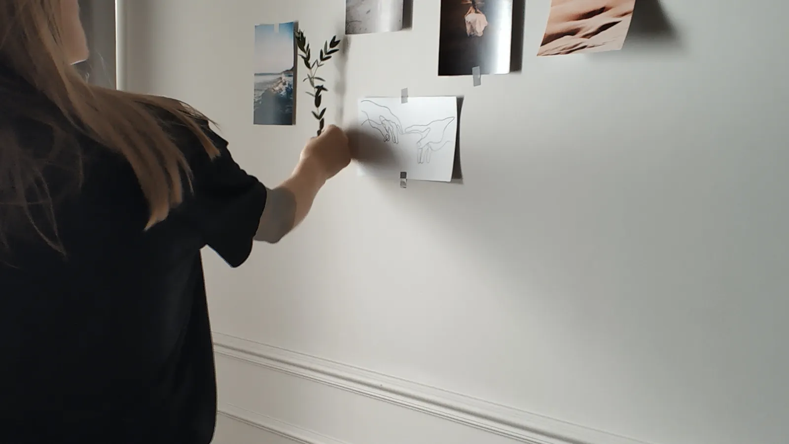 Professional planning a visual workflow beside a laptop, illustrating AI-assisted marketing automation and process design