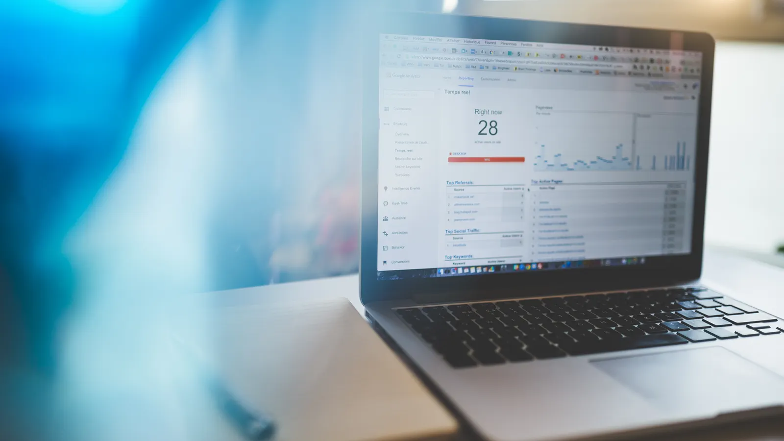 Laptop displaying web analytics in a professional workspace, illustrating marketing attribution from leads to revenue