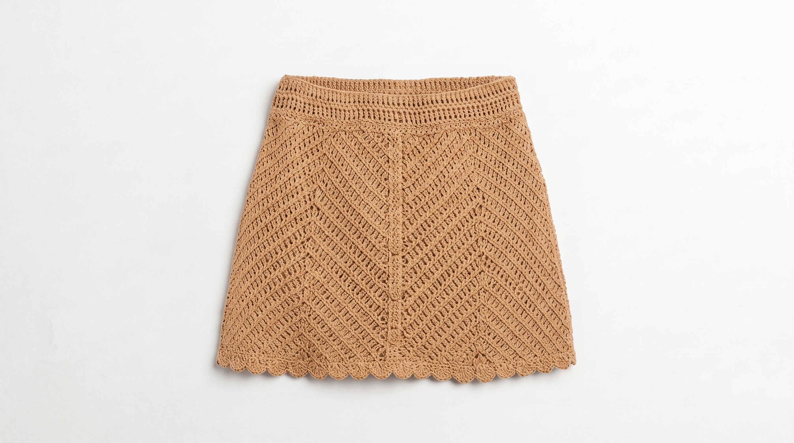 Hand crocheted skirt in tan cotton with openwork stitch and a scalloped hem