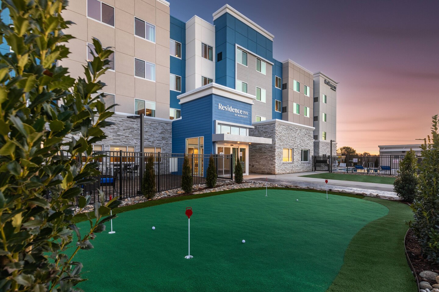 Residence Inn by Marriott Anderson Clemson hotel exterior at dusk with putting green in the foreground