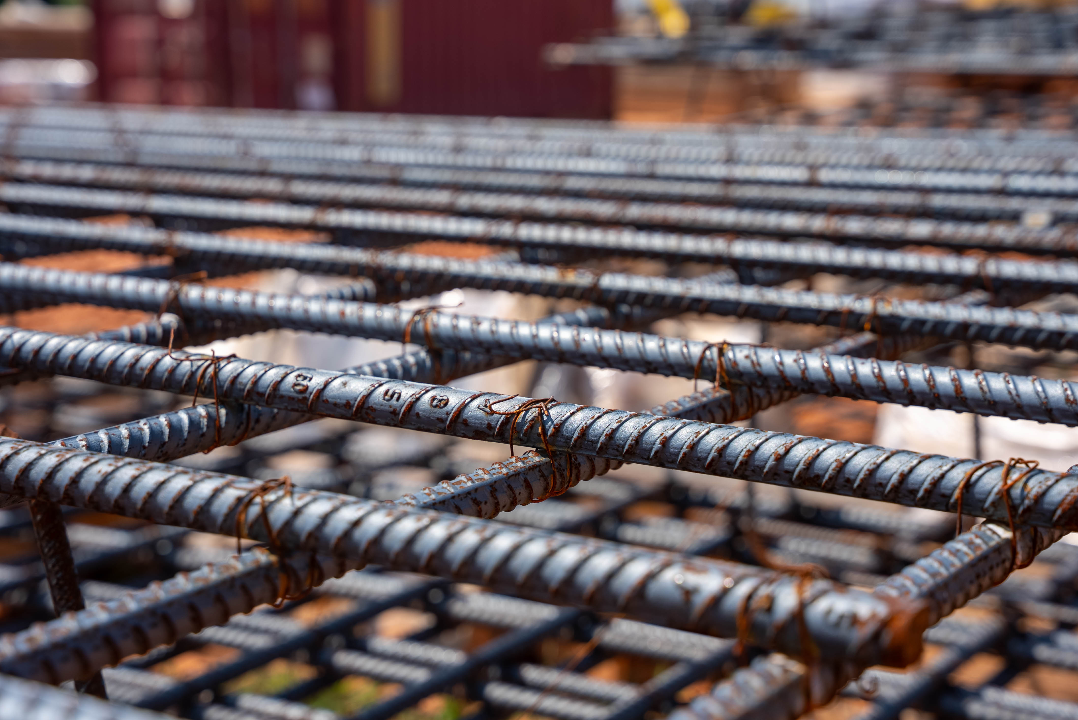 Close-up of rebar mesh laid for a concrete pour at a commercial construction site