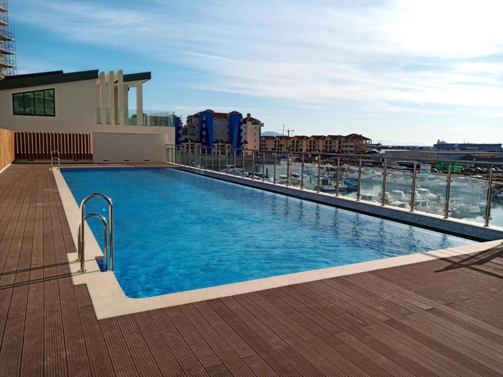 Rooftop pool at Kings Wharf, Gibraltar, overlooking the marina and waterfront apartments