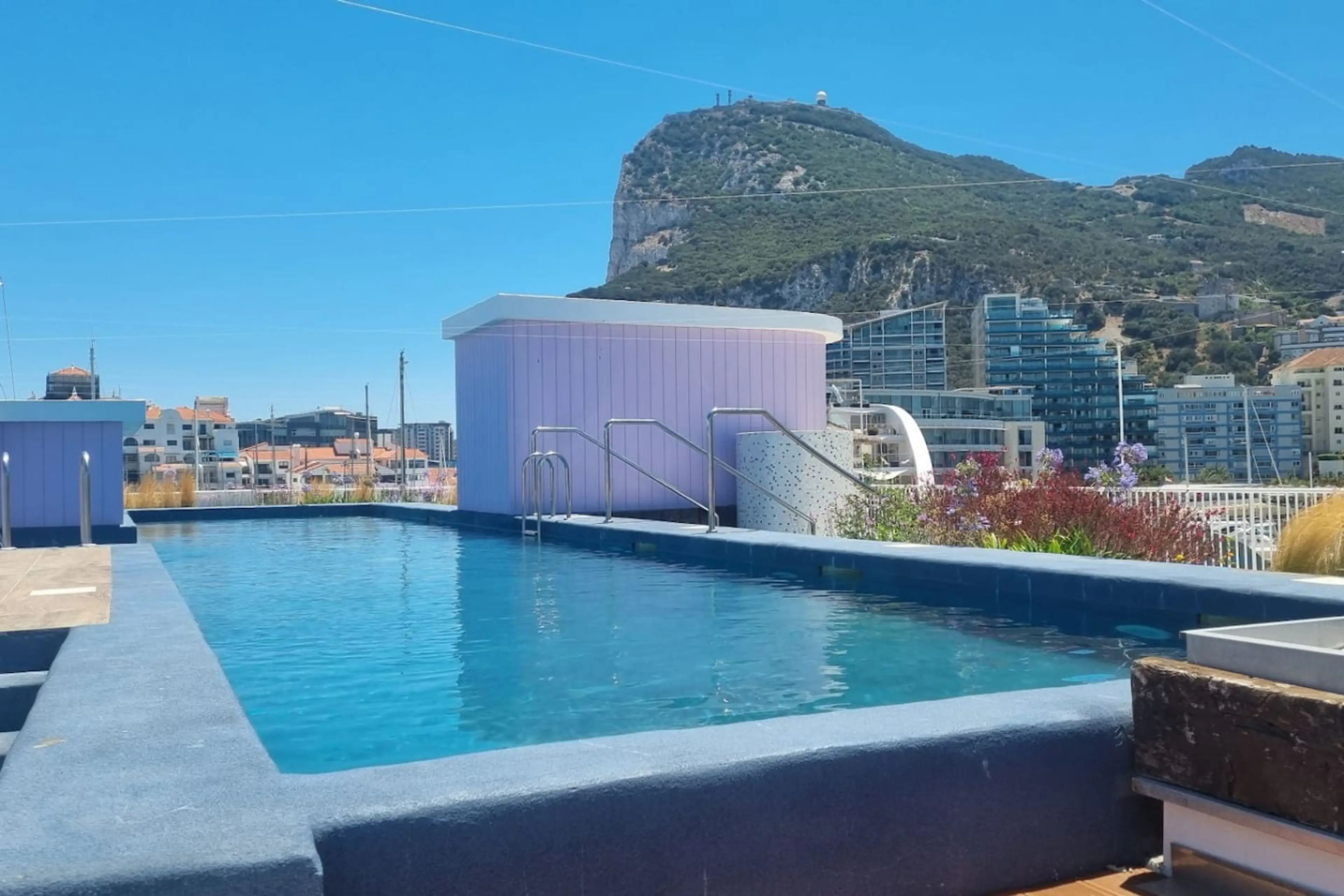 Rooftop pool at Marina Club with the Rock of Gibraltar rising behind it