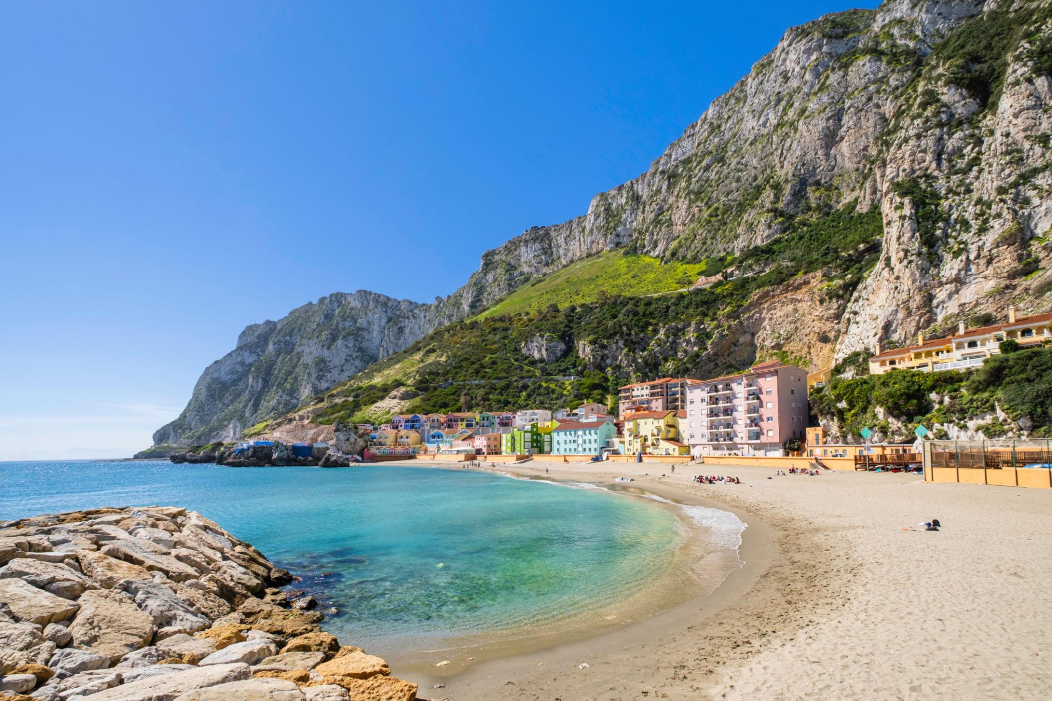 Catalan Bay beach and its coloured houses below the east side of the Rock