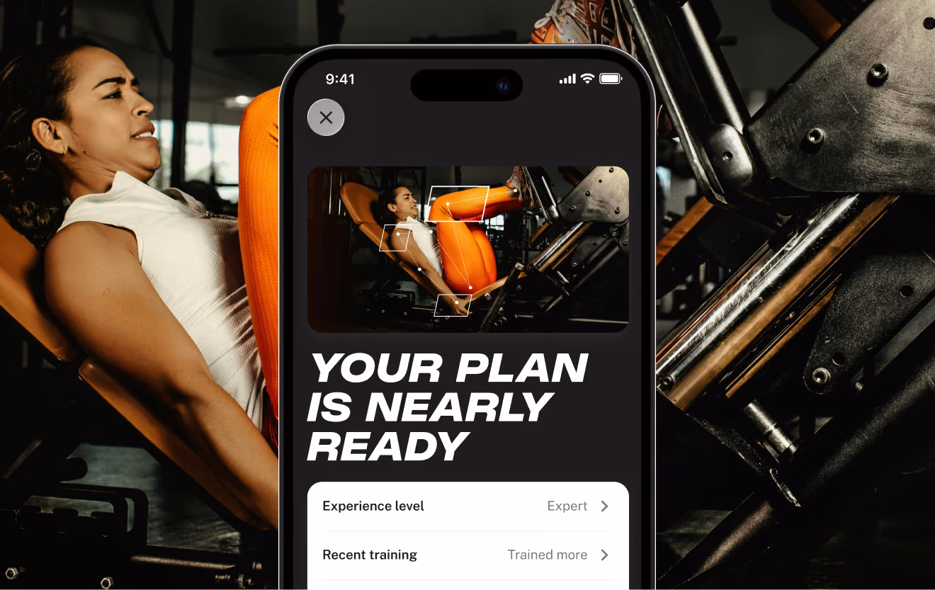 Woman using leg press machine at the gym with an overlaid smartphone screen showing a workout app that reads 'Your plan is nearly ready' and options for experience level and recent training.