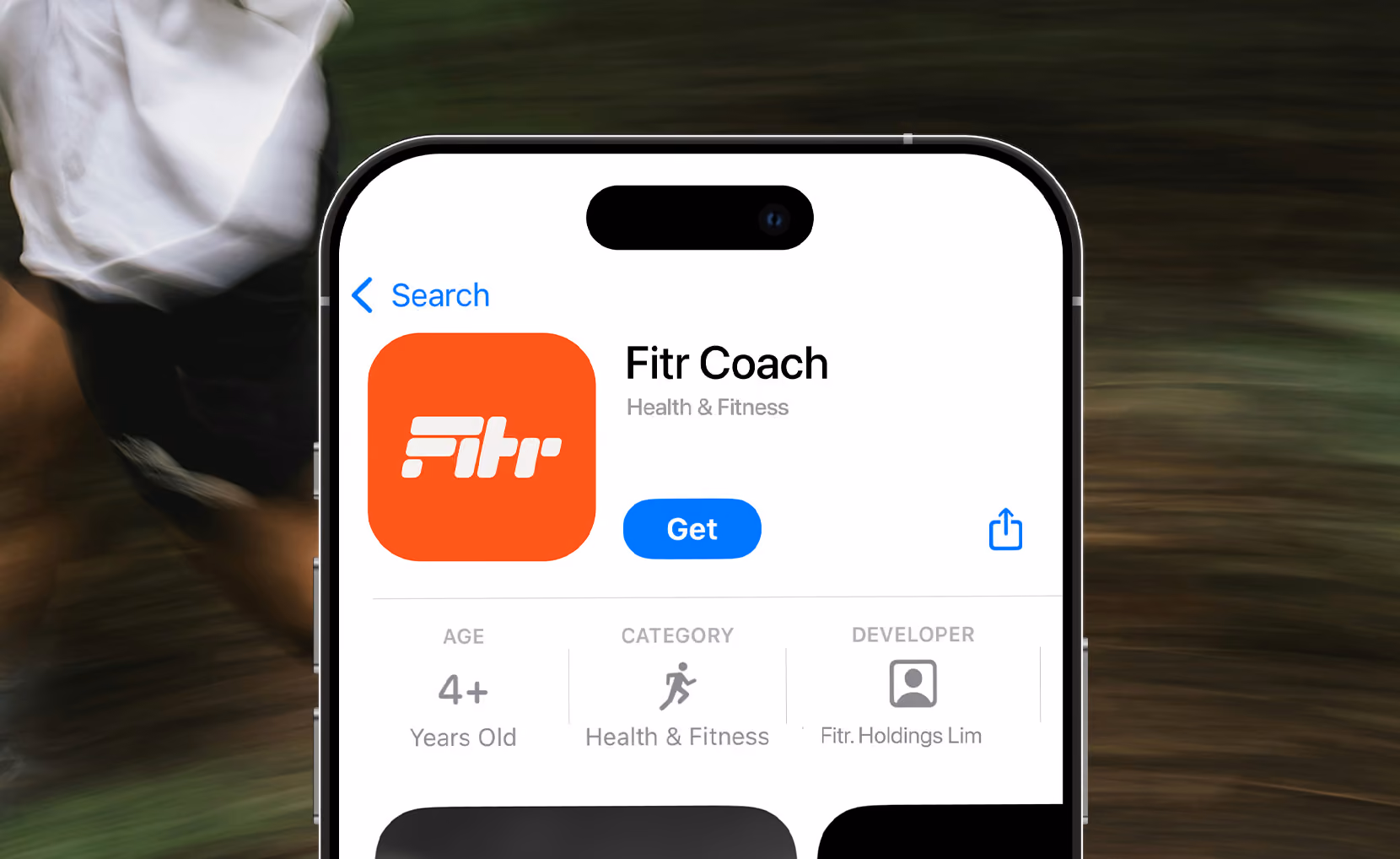 Close-up of a smartphone screen showing the Fitr Coach app page in the app store, with an orange logo, category Health & Fitness, age rating 4+, and a blue Get button.
