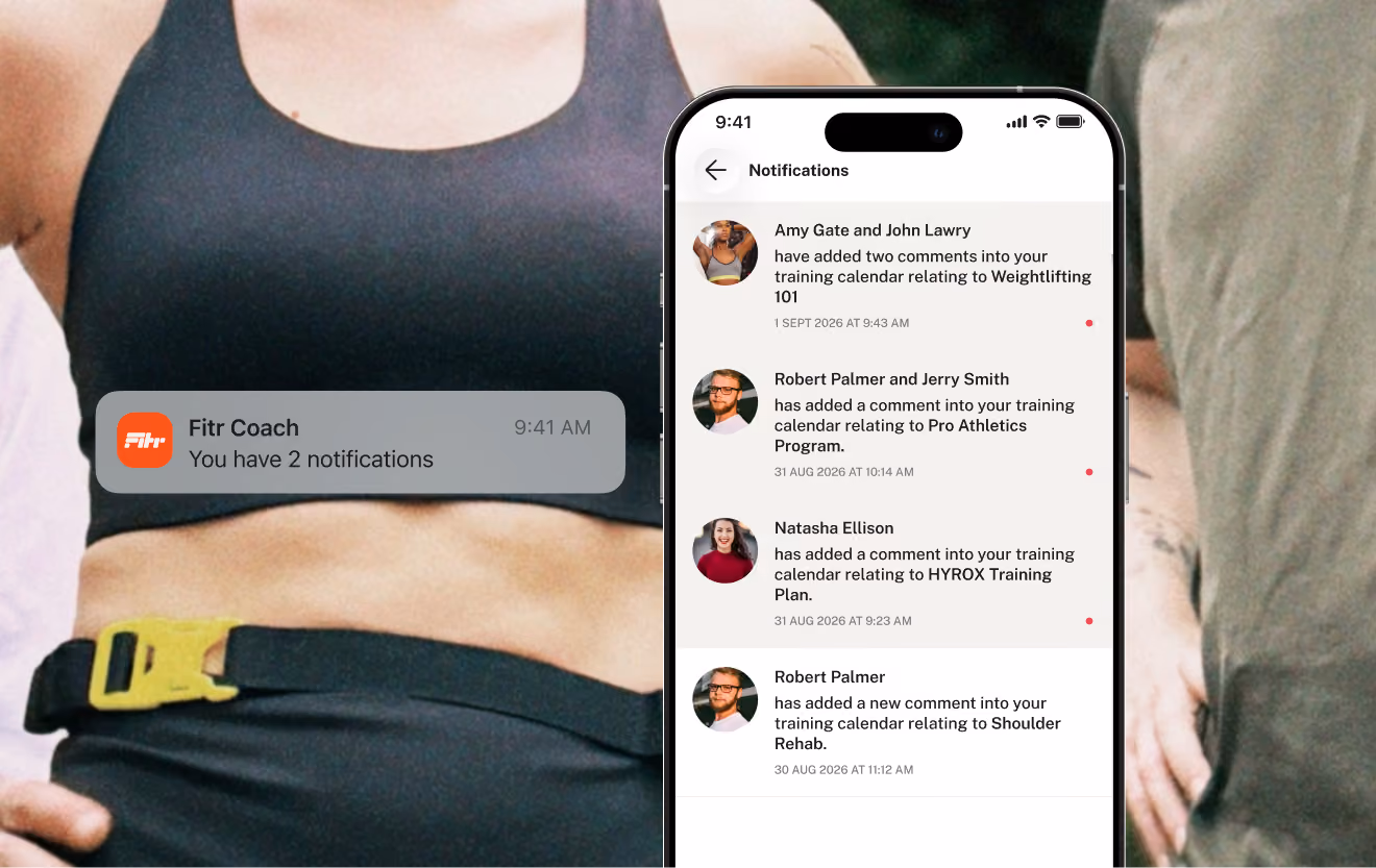 Smartphone screen showing notifications from a fitness coaching app, listing comments added by users Amy Gate, John Lawry, Robert Palmer, Jerry Smith, and Natasha Ellison to a training calendar for weightlifting, pro athletics, HYROX training, and shoulder rehab, alongside a notification banner indicating two new notifications, with a person in a sports bra and fitness gear partially visible behind the phone.