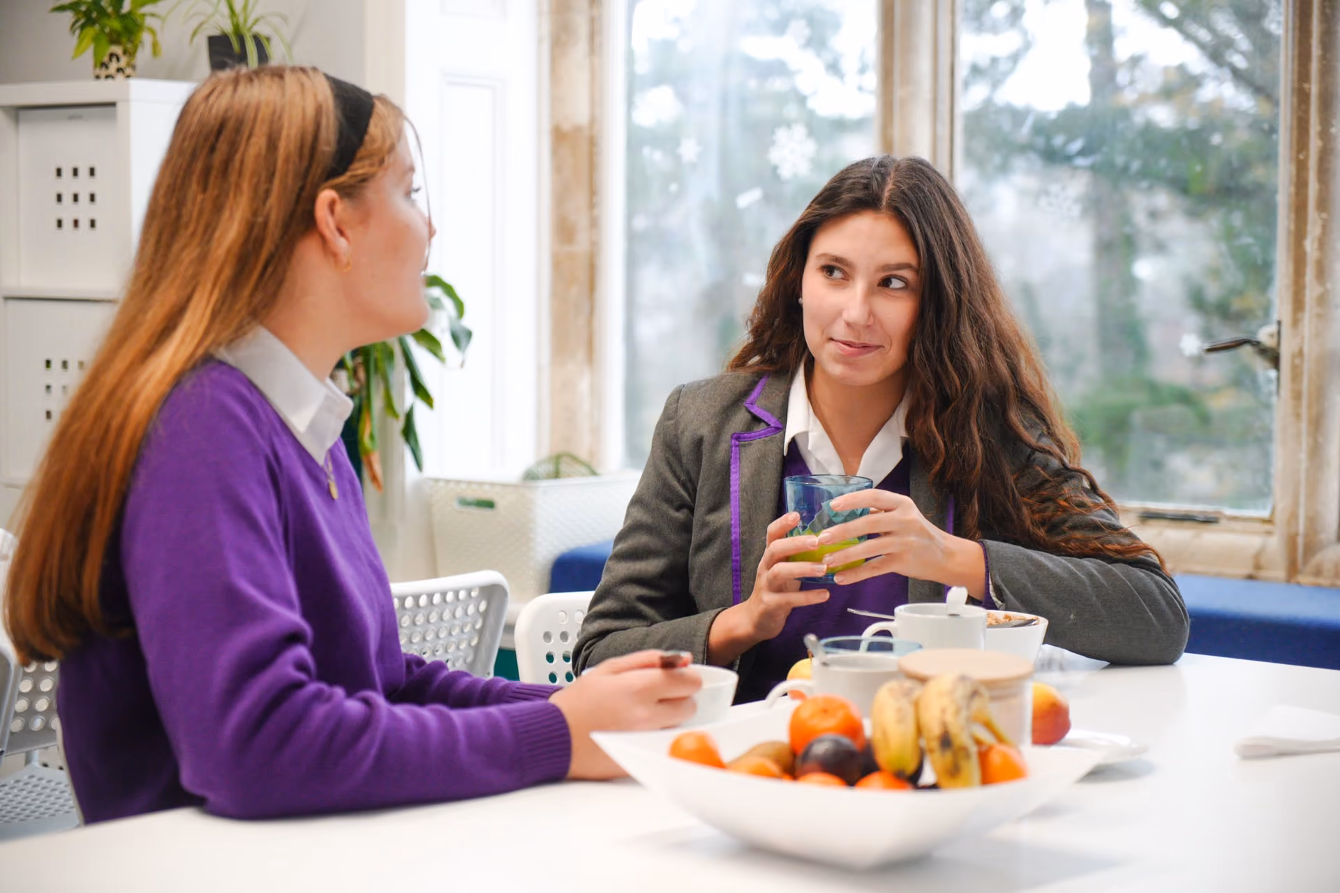 Boarders chatting with their houseparent in the house lounge