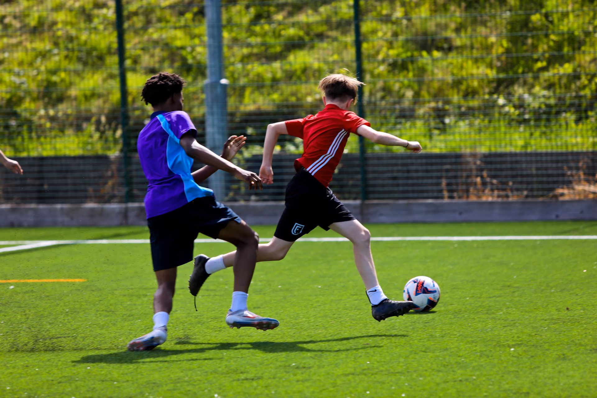 FC Rise players training on the all-weather pitch
