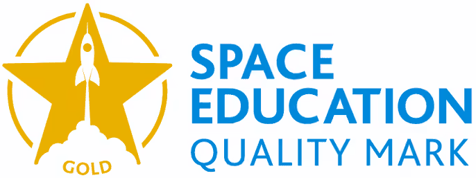 Gold star emblem with a rocket launching in the center and the word 'GOLD' beneath it, next to blue text reading 'SPACE EDUCATION QUALITY MARK'.
