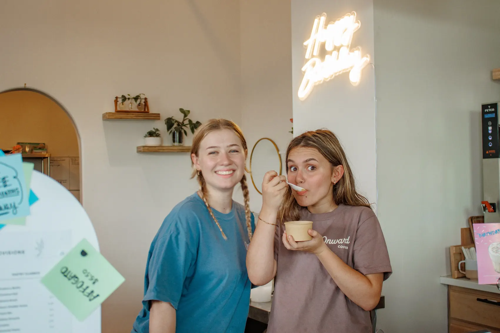 Two friends enjoying treats at the Onward counter