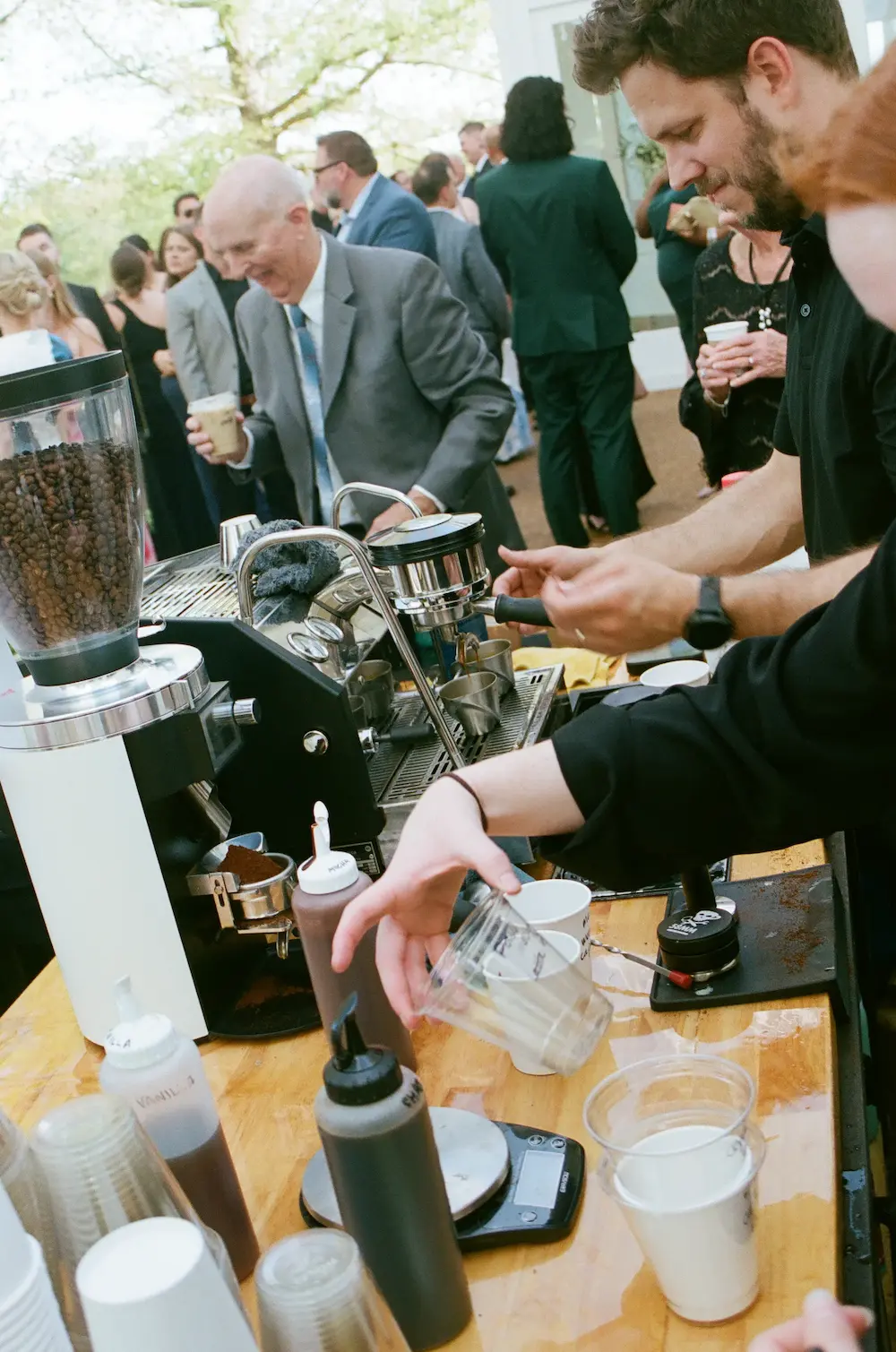 Barista crafting drinks at the Onward coffee bar