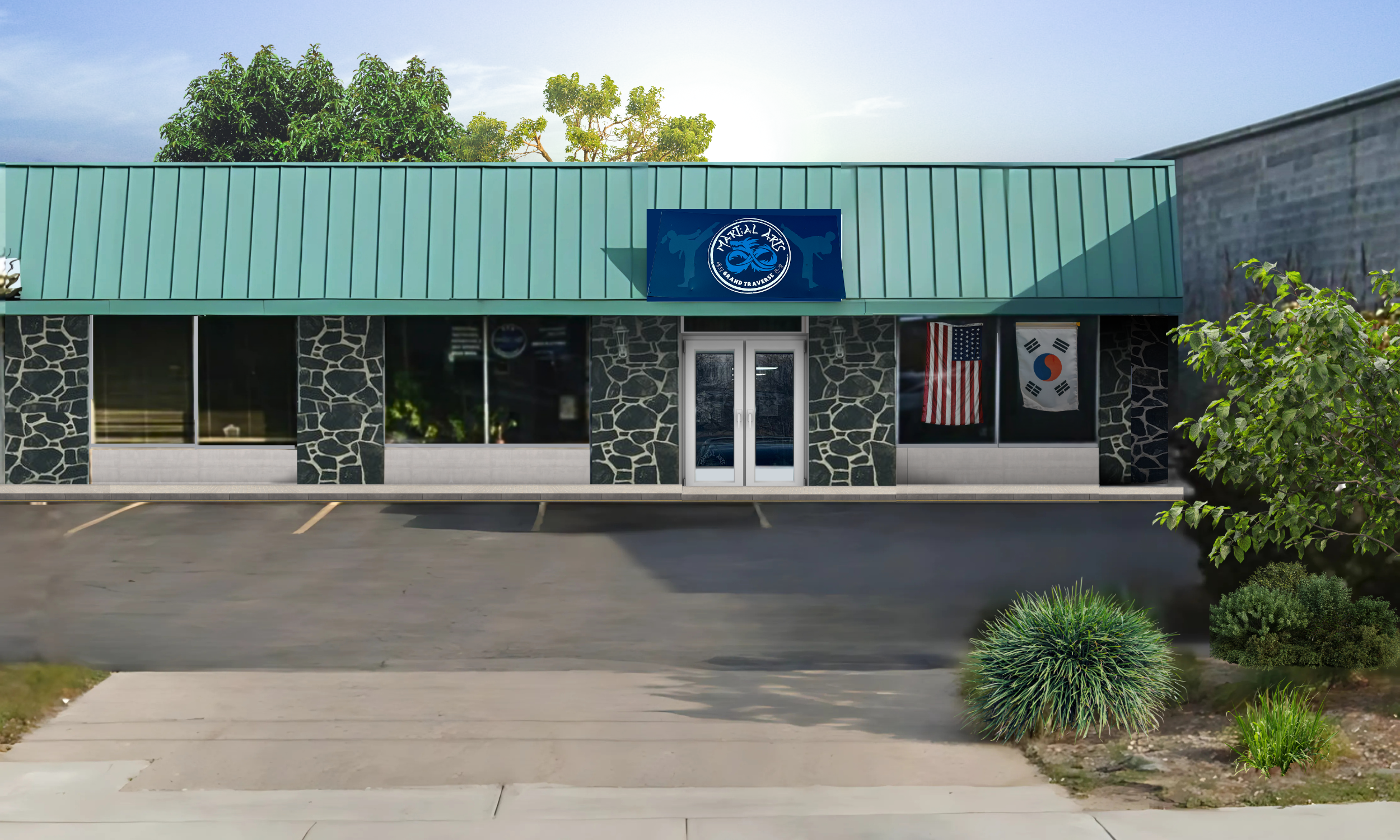 A single-story martial arts training facility with green roof, stone-textured facade, and flags displayed on the storefront.