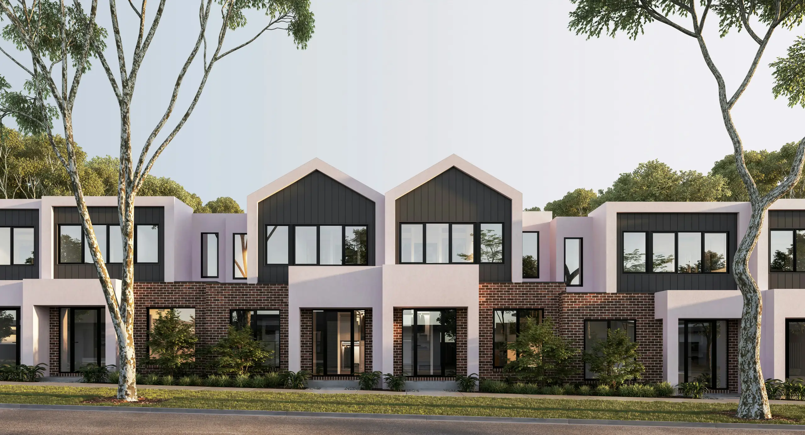 Row of new townhouses with gabled roofs
