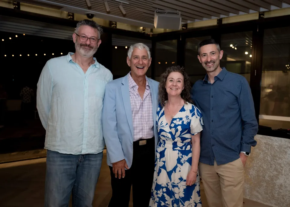 Four StrataMax team members at an evening company event