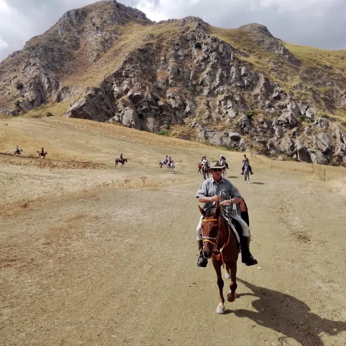 Riders and horses top of mountain Sicily Trail riding