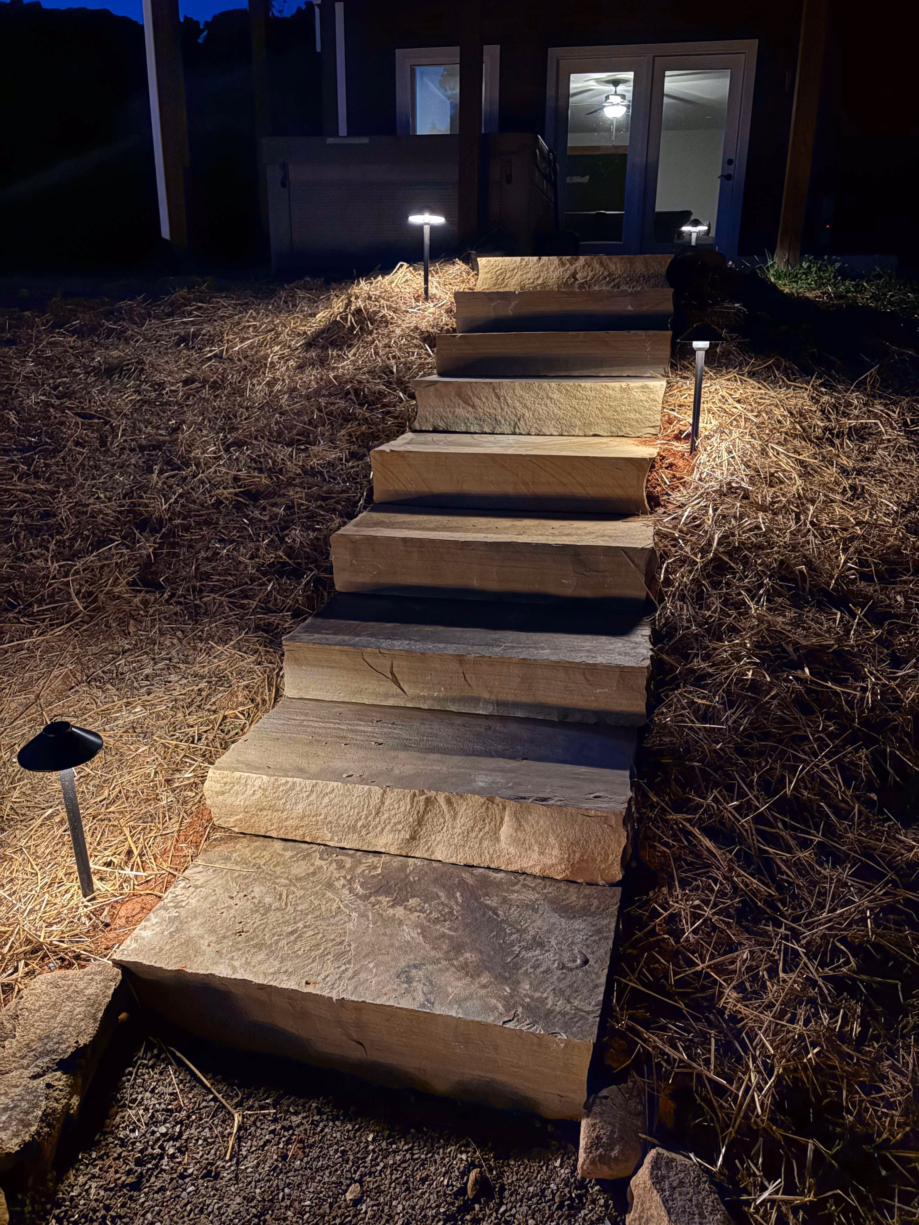landscape lighting and custom rock walkway design by Rowland Outdoor Design