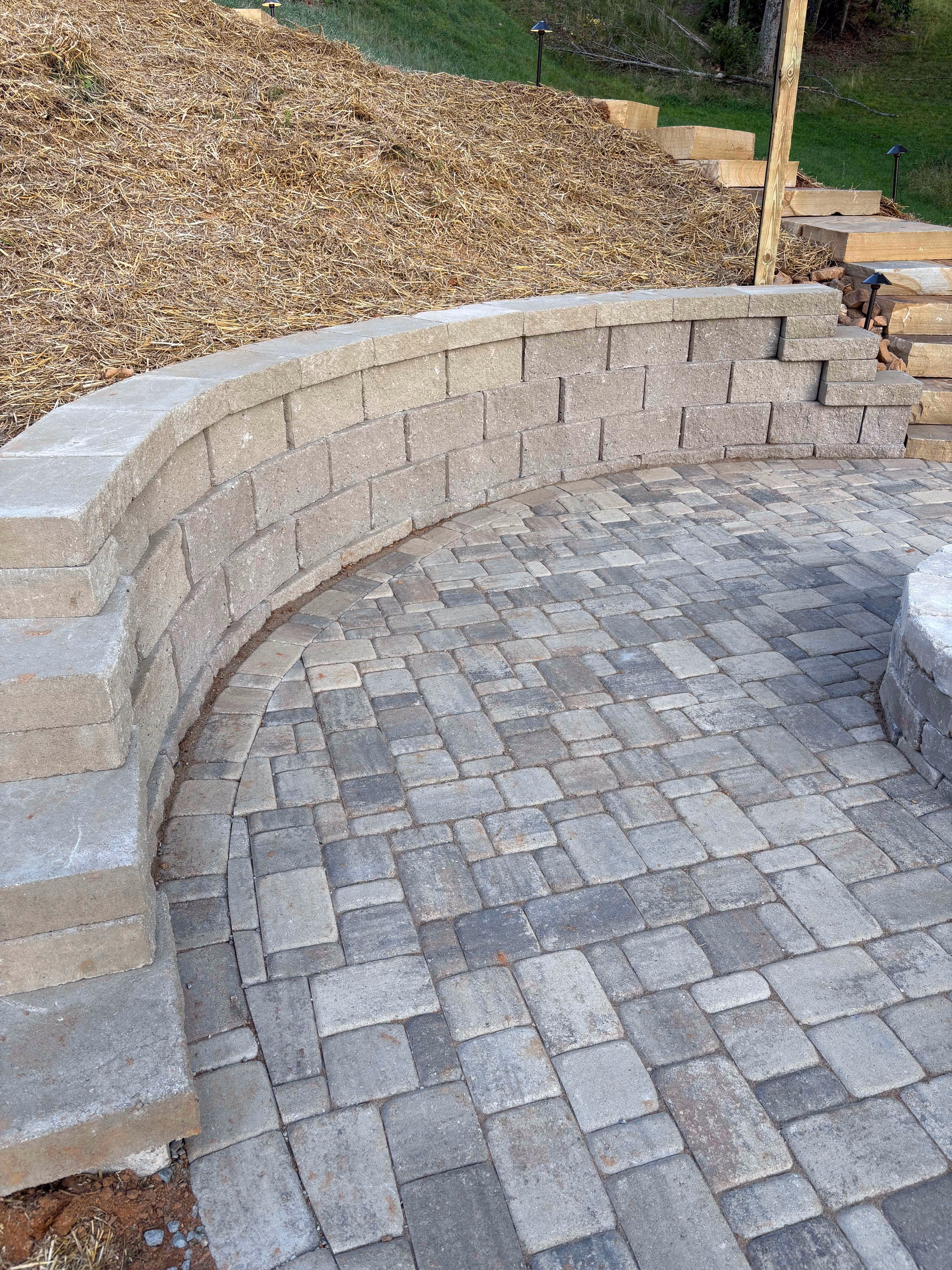 Custom retaining wall installation in by Rowland Outdoor Design