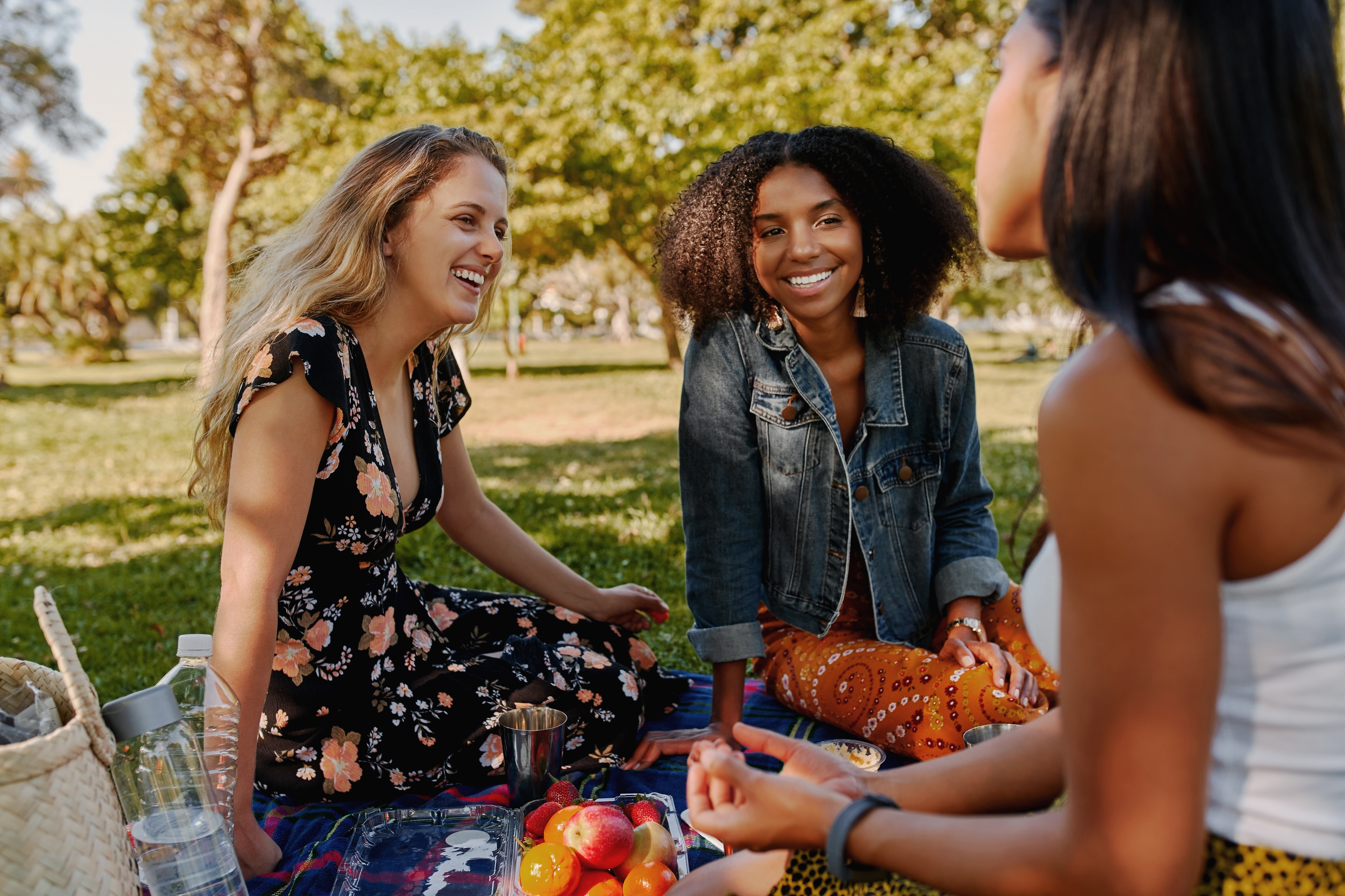 Girls sitting outside eating stock image