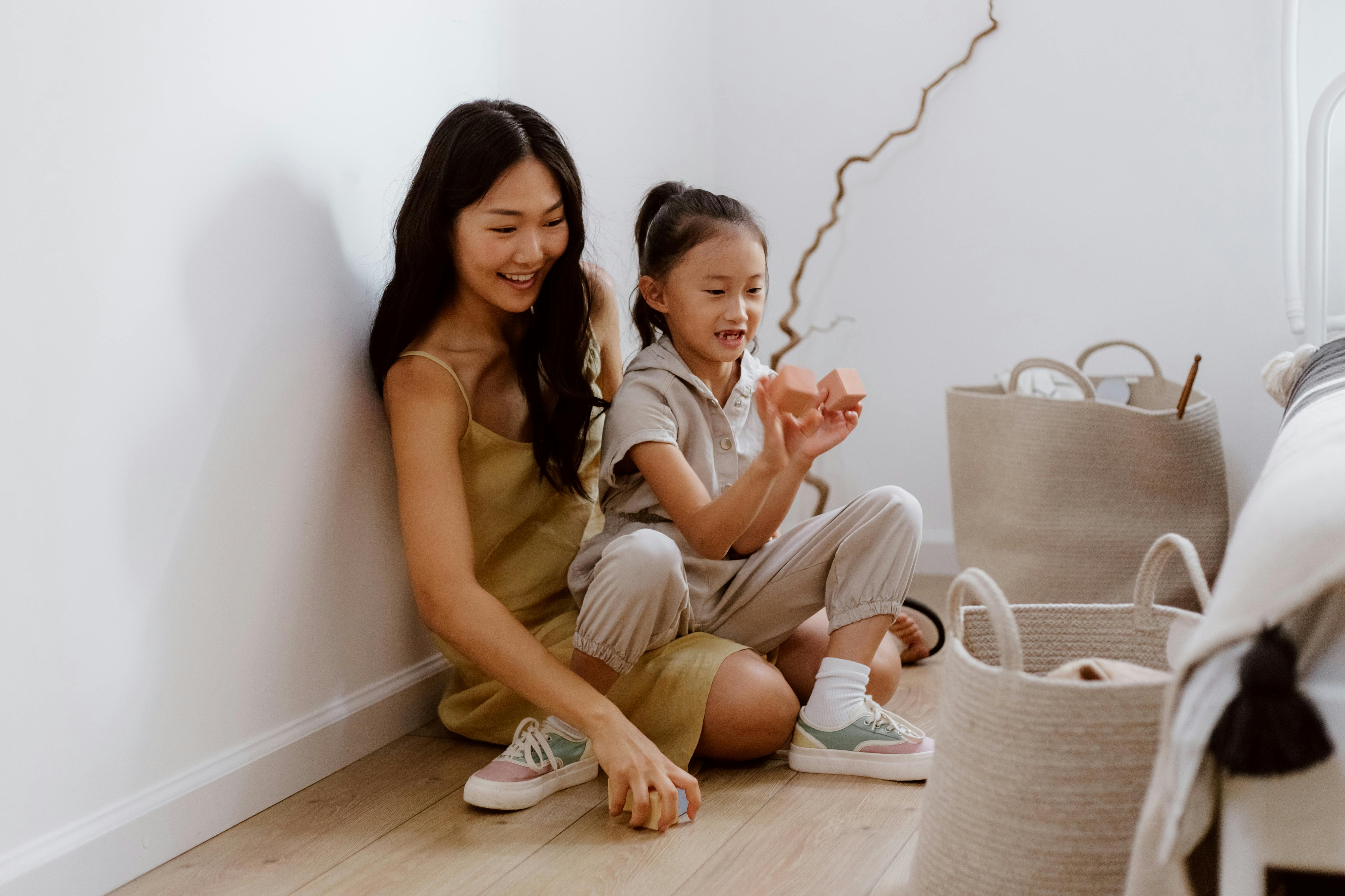 Woman playing with child stock image