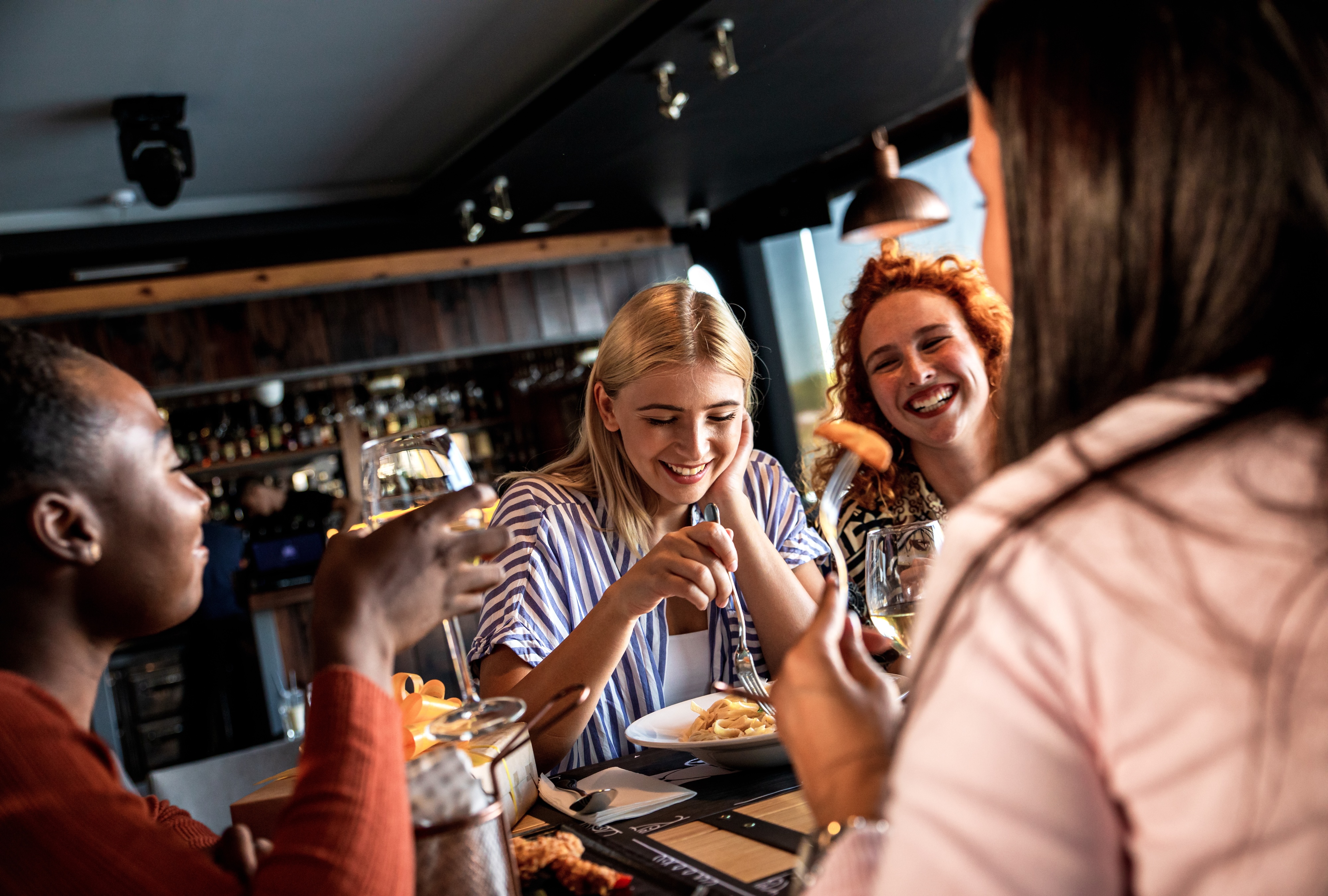 People eating at restaurant stock image