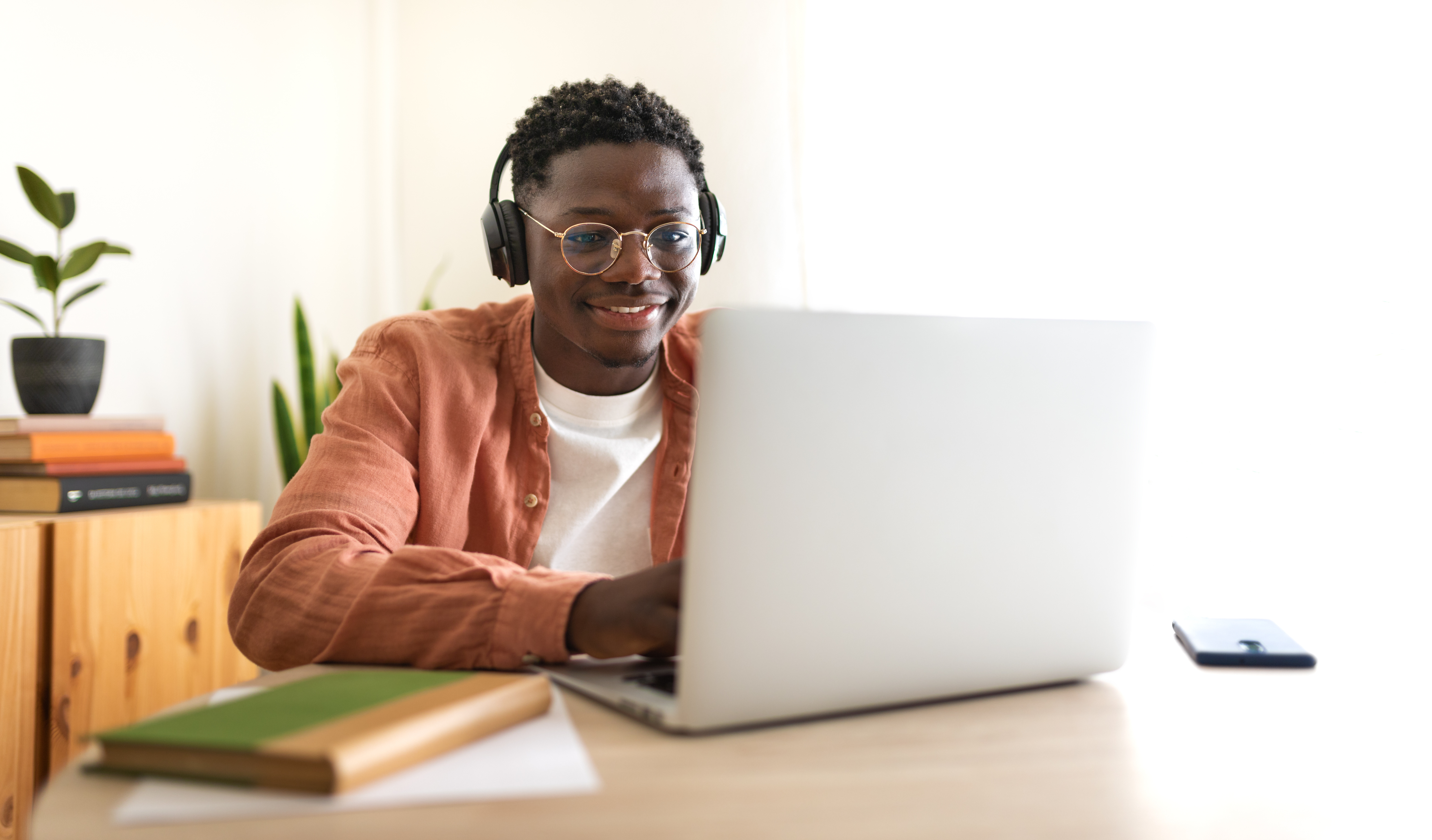 Boy sitting at computer stock image