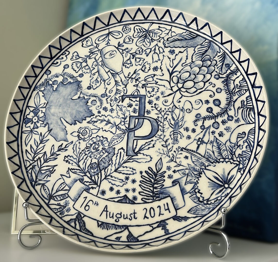 Hand-painted blue and white wedding plate with JP monogram and fine details