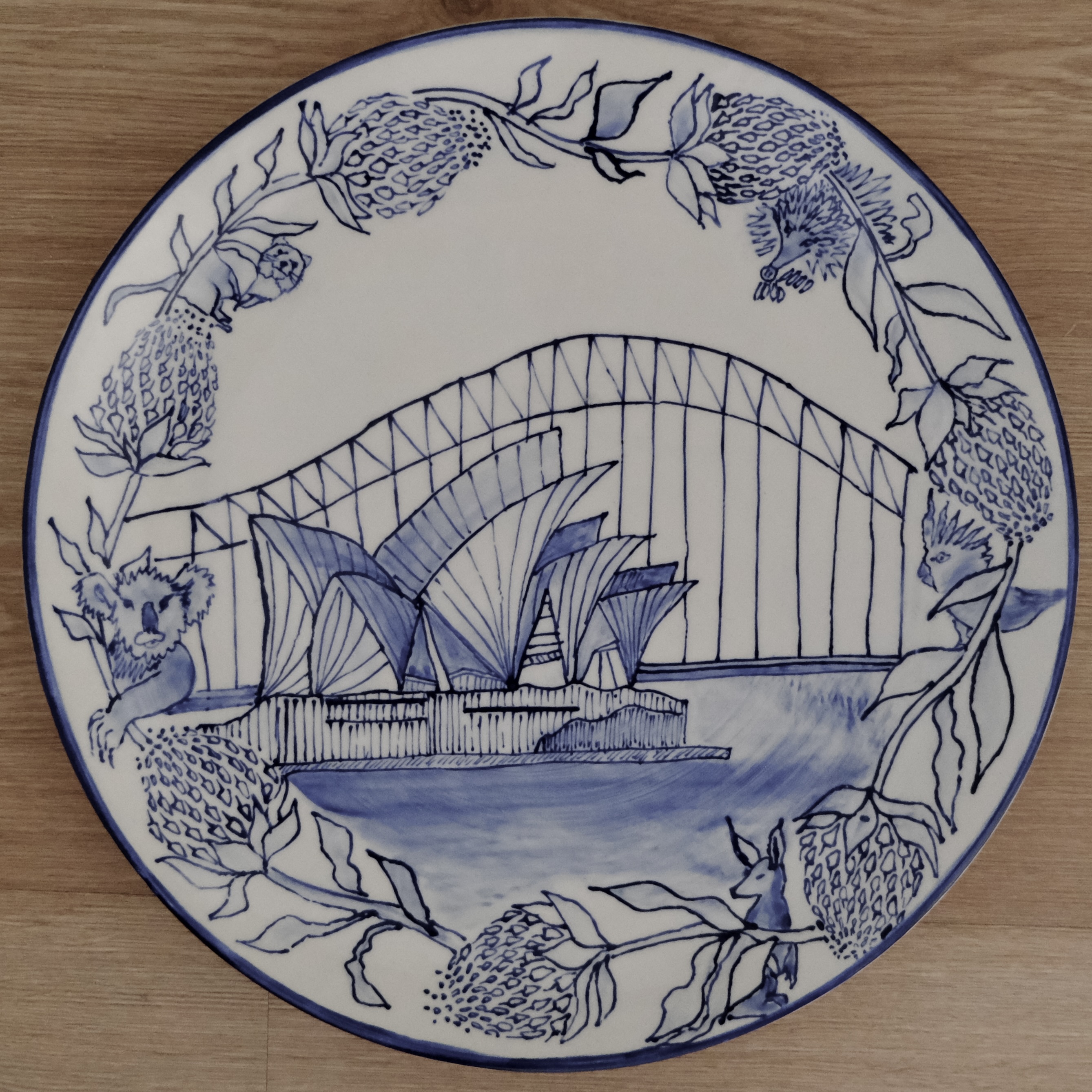 Hand-painted blue and white plate of the Sydney Opera House