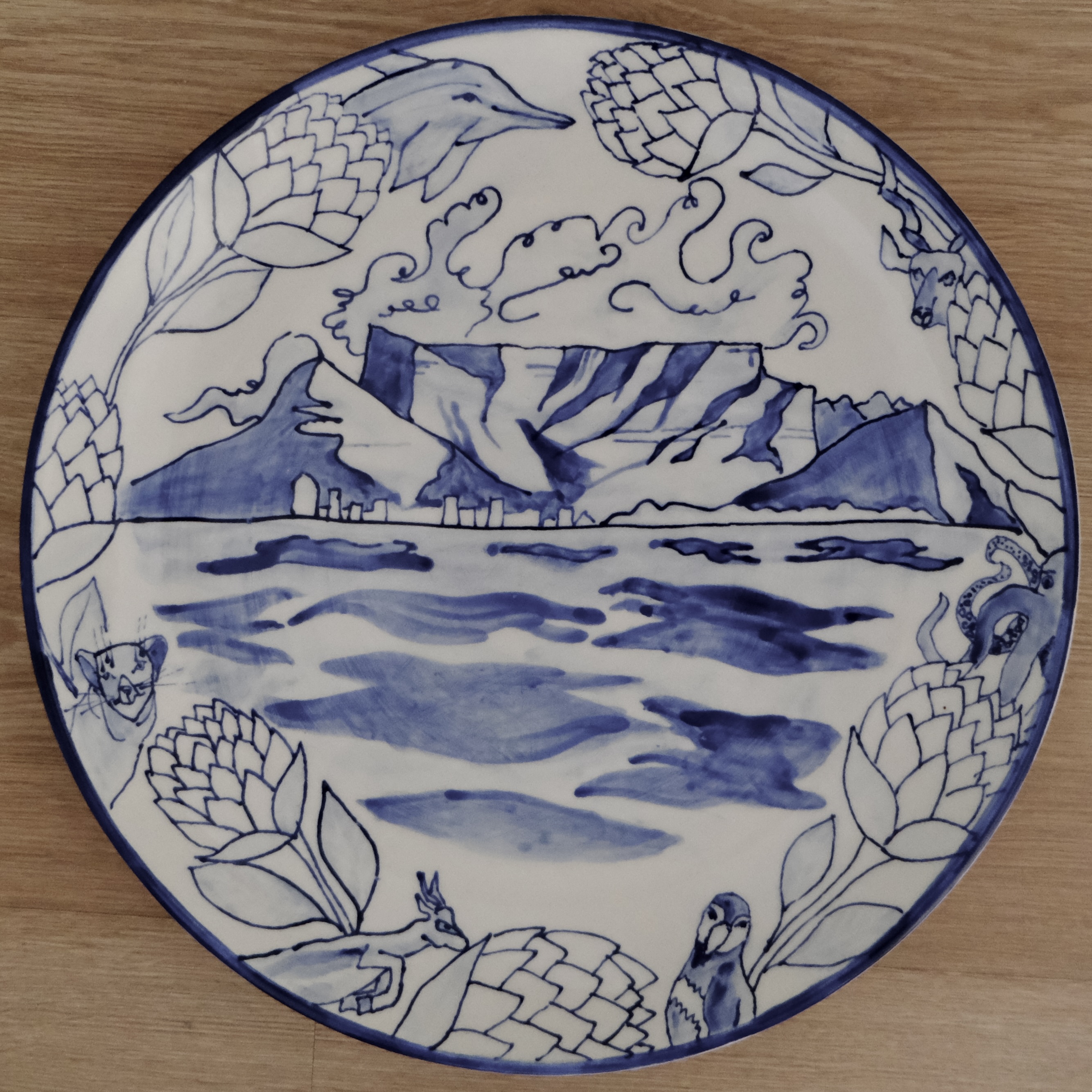 Hand-painted blue and white plate of Table Bay and Table Mountain